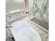 Bathroom featuring a soaking tub, double sink vanity, and a tiled shower at 3189 Jackson, Hapeville, GA 30354