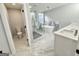 A bathroom featuring a toilet, glass shower, a standalone tub, and double sinks at 3189 Jackson, Hapeville, GA 30354