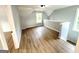 Spacious bedroom features light gray walls, light hardwood floors, and natural light from two windows at 3189 Jackson, Hapeville, GA 30354