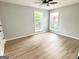Bedroom featuring hardwood floors and two large windows at 3189 Jackson, Hapeville, GA 30354