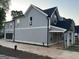 New home featuring a grey exterior, attached garage, and a covered side porch at 3189 Jackson, Hapeville, GA 30354