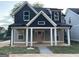 Charming new two-story home featuring a welcoming front porch and a pink front door at 3189 Jackson, Hapeville, GA 30354
