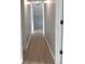 Hallway featuring neutral wall paint and wood-look floors that leads to other rooms at 3189 Jackson, Hapeville, GA 30354
