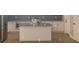 Bright kitchen with stainless steel appliances, granite countertops, and a center island with a sink at 3189 Jackson, Hapeville, GA 30354