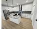 Stylish kitchen featuring stainless steel appliances, granite countertops, and an island with a sink at 3189 Jackson, Hapeville, GA 30354