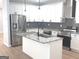 Bright kitchen featuring stainless appliances, granite counters and an island with sink at 3189 Jackson, Hapeville, GA 30354