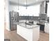 Bright kitchen featuring stainless appliances, granite counters and an island with sink at 3189 Jackson, Hapeville, GA 30354