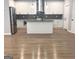 Modern kitchen featuring white cabinets, stainless steel appliances, and a center island at 3189 Jackson, Hapeville, GA 30354