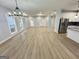 Expansive living space with wood floors, an open layout, and views into the modern kitchen at 3189 Jackson, Hapeville, GA 30354
