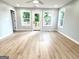 Spacious living room with hardwood floors, natural light, and neutral gray paint at 3189 Jackson, Hapeville, GA 30354