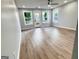 Bright room featuring hardwood floors and three large windows at 3189 Jackson, Hapeville, GA 30354