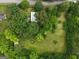 Aerial view of a home surrounded by lush trees and sprawling green lawn at 7550 Fielder Rd, Jonesboro, GA 30236