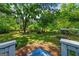 Expansive, shaded backyard with lush greenery, mature trees, and a tranquil setting creates an ideal outdoor space at 7550 Fielder Rd, Jonesboro, GA 30236