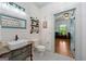 Bright bathroom featuring black and white tile, a shiplap wall, and colorful decor at 7550 Fielder Rd, Jonesboro, GA 30236