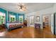 Bedroom with hardwood floors, natural light and unique blue and white wall design at 7550 Fielder Rd, Jonesboro, GA 30236