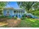 Quaint blue home featuring a classic porch and an inviting outdoor space at 7550 Fielder Rd, Jonesboro, GA 30236