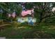 Charming two-story blue home with a welcoming front porch and lush green yard at 7550 Fielder Rd, Jonesboro, GA 30236