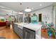 Bright open kitchen featuring an island with seating and stainless steel appliances at 7550 Fielder Rd, Jonesboro, GA 30236