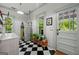 Functional laundry room featuring black and white tile floors and an exterior door at 7550 Fielder Rd, Jonesboro, GA 30236