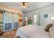 Charming bedroom with an accent wall, sliding barn doors, and access to an ensuite bathroom at 7550 Fielder Rd, Jonesboro, GA 30236