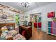 Bright office featuring wood floors, shiplap walls, and unique and colorful accents at 7550 Fielder Rd, Jonesboro, GA 30236