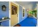 Inviting covered porch featuring a welcoming front door and a bench at 7550 Fielder Rd, Jonesboro, GA 30236