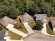 Aerial view of homes in a well-maintained community, surrounded by lush greenery, highlighting the neighborhood's appeal at 1152 Strath Clyde Way, Mcdonough, GA 30253