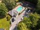 Aerial view of community pool, tennis court, clubhouse, and parking at 1152 Strath Clyde Way, Mcdonough, GA 30253
