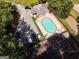 Aerial view of community pool, tennis court, clubhouse, and parking at 1152 Strath Clyde Way, Mcdonough, GA 30253