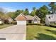 Charming single-story brick home with manicured lawn, a two-car garage, and mature trees in a desirable neighborhood at 1152 Strath Clyde Way, Mcdonough, GA 30253