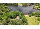 Breathtaking aerial view of a lakeside home surrounded by lush green trees and serene waters at 312 Flat Shoals Church Rd, Stockbridge, GA 30281