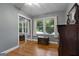 Well-lit bedroom with hardwood floors, closet with mirror doors, and serene views from the window at 312 Flat Shoals Church Rd, Stockbridge, GA 30281
