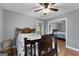 Charming bedroom featuring a ceiling fan, wood floors, and a mirrored closet at 312 Flat Shoals Church Rd, Stockbridge, GA 30281