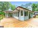 Expansive wooden deck with lots of room to sit and entertain while enjoying scenic backyard views at 312 Flat Shoals Church Rd, Stockbridge, GA 30281