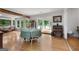 Dining room featuring hardwood floors, white walls, views of the lake, and dining table at 312 Flat Shoals Church Rd, Stockbridge, GA 30281
