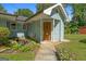 Close up view of home entrance with a flower bed and small fish pond at 312 Flat Shoals Church Rd, Stockbridge, GA 30281