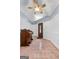 Home foyer with white walls, tile floor and a vintage piano and a door at 312 Flat Shoals Church Rd, Stockbridge, GA 30281