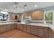Bright kitchen featuring hardwood floors and wood cabinetry at 312 Flat Shoals Church Rd, Stockbridge, GA 30281