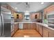 Spacious kitchen with hardwood floors and stainless steel appliances at 312 Flat Shoals Church Rd, Stockbridge, GA 30281