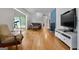 Open floor plan with hardwood floors connects the living room to the sunroom and other living spaces at 312 Flat Shoals Church Rd, Stockbridge, GA 30281