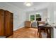 Office space features natural light, hardwood floors, a built-in desk, and a view of the landscaped yard at 312 Flat Shoals Church Rd, Stockbridge, GA 30281