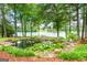 Picturesque pond with water lilies, lush greenery, and a tranquil waterfront setting at 312 Flat Shoals Church Rd, Stockbridge, GA 30281