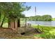 Rustic shed on a waterfront property, offering charm and storage options at 312 Flat Shoals Church Rd, Stockbridge, GA 30281