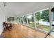 Sunroom with floor to ceiling windows and views of the lake at 312 Flat Shoals Church Rd, Stockbridge, GA 30281