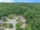 This aerial view displays beautiful homes surrounded by lush green trees in a well-maintained neighborhood at 5409 Trumpet Vine Se Trl, Mableton, GA 30126