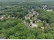 This aerial view showcases the community featuring beautiful homes surrounded by lush green trees in a well-maintained neighborhood at 5409 Trumpet Vine Se Trl, Mableton, GA 30126