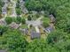 The aerial view of this community features beautiful homes surrounded by lush green trees in a well-maintained neighborhood at 5409 Trumpet Vine Se Trl, Mableton, GA 30126