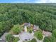 An attractive aerial view displaying beautiful homes surrounded by lush green trees in a well-maintained neighborhood at 5409 Trumpet Vine Se Trl, Mableton, GA 30126