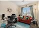 Cozy home office with a comfortable sofa, desk setup, and ample natural light at 5409 Trumpet Vine Se Trl, Mableton, GA 30126