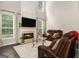 Bright living room features a fireplace, high ceilings, and comfortable seating at 5409 Trumpet Vine Se Trl, Mableton, GA 30126